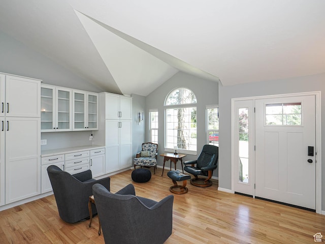 1402 E Valley Ridge Dr S, Sandy, UT 84093 - living room with healthy amount of natural light, vaulted ceiling, and light wood-style floors