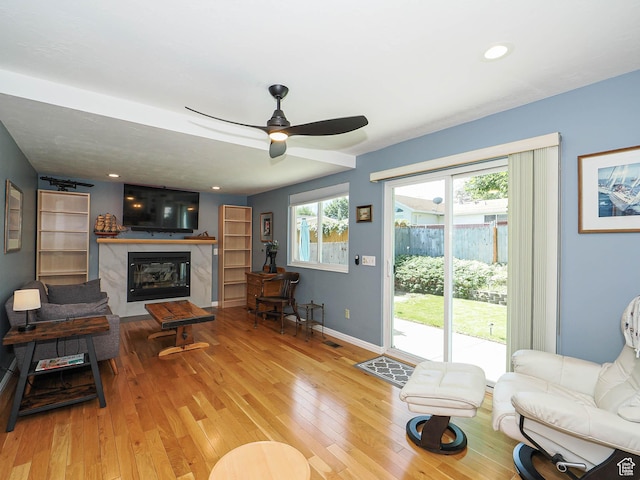1402 E Valley Ridge Dr S, Sandy, UT 84093 - living room featuring wood-type flooring, a premium fireplace, ceiling fan, and recessed lighting