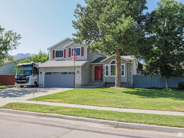 1402 E Valley Ridge Dr S, Sandy, UT 84093 - traditional-style house featuring a garage, concrete driveway, and stone siding