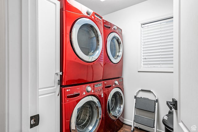 93 S 1250 E, Logan, UT 84321 - washroom with estacked washer and dryer, wood finished floors, and heating unit