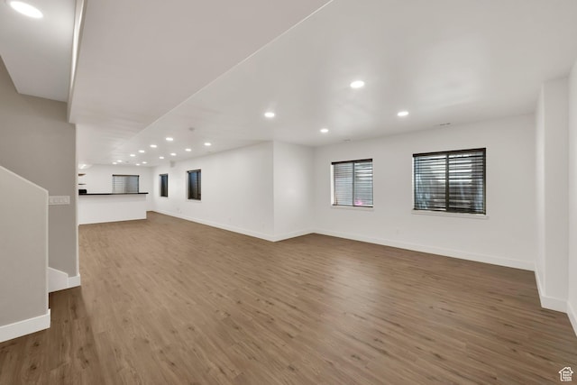 3179 W Hayden Ridge Way S, Riverton, UT 84065 - unfurnished living room with wood finished floors and recessed lighting