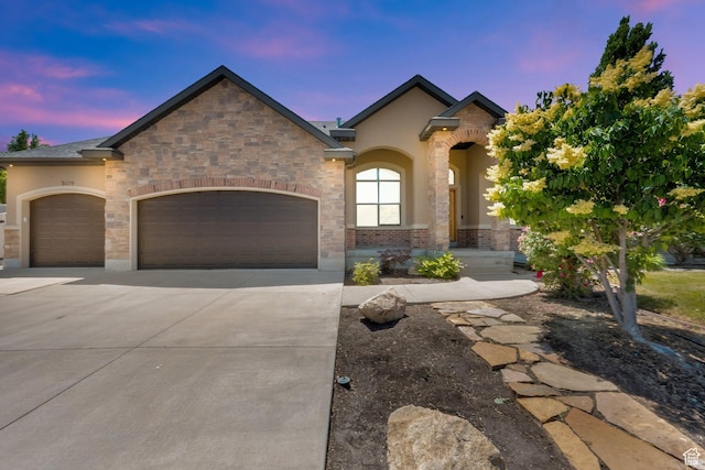 3179 W Hayden Ridge Way S, Riverton, UT 84065 - french country style house with an attached garage, driveway, and stucco siding