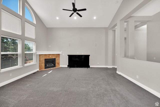 3179 W Hayden Ridge Way S, Riverton, UT 84065 - unfurnished living room with carpet flooring, a tile fireplace, high vaulted ceiling, a ceiling fan, and recessed lighting