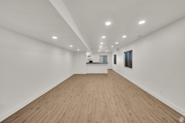 3179 W Hayden Ridge Way S, Riverton, UT 84065 - unfurnished living room featuring recessed lighting and light wood-style flooring