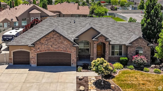 3179 W Hayden Ridge Way S, Riverton, UT 84065 - view of front of home with driveway, a garage, and brick siding