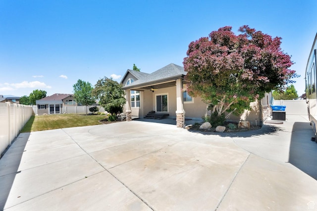 3179 W Hayden Ridge Way S, Riverton, UT 84065 - view of front of property with stucco siding, a fenced backyard, and ceiling fan