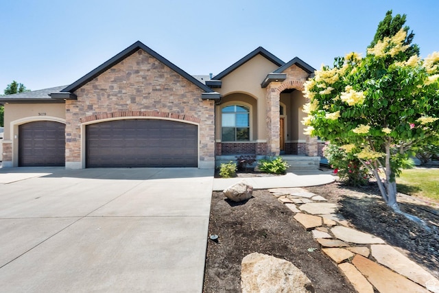 3179 W Hayden Ridge Way S, Riverton, UT 84065 - french country home with an attached garage, driveway, and stucco siding