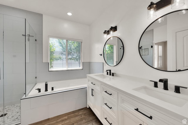3179 W Hayden Ridge Way S, Riverton, UT 84065 - full bath featuring a garden tub, double vanity, a tile shower, wood finished floors, and recessed lighting