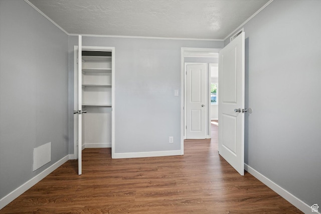 1302 E Harrop S, Ogden, UT 84404 - unfurnished bedroom with ornamental molding, wood finished floors, a closet, and a textured ceiling