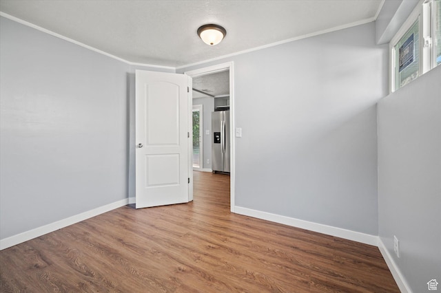 1302 E Harrop S, Ogden, UT 84404 - unfurnished room featuring ornamental molding and wood finished floors