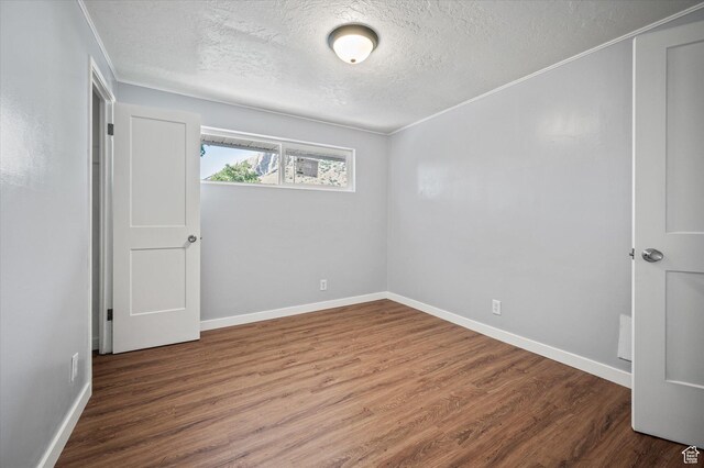 1302 E Harrop S, Ogden, UT 84404 - empty room with a textured ceiling and wood finished floors