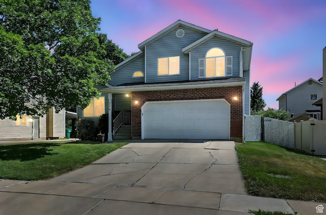 433 W 2425 N, Harrisville, UT 84414 - traditional home featuring a garage, concrete driveway, and brick siding