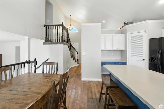 433 W 2425 N, Harrisville, UT 84414 - dining room with a chandelier, dark wood-style floors, recessed lighting, stairway, and high vaulted ceiling
