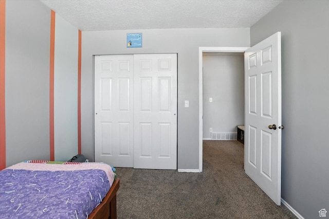 433 W 2425 N, Harrisville, UT 84414 - bedroom featuring carpet flooring, a closet, and a textured ceiling