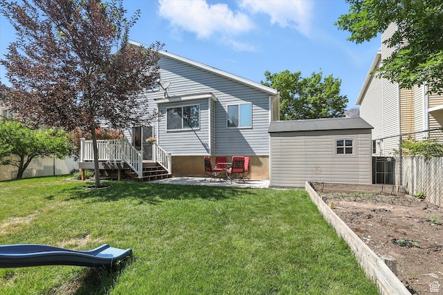 433 W 2425 N, Harrisville, UT 84414 - back of house with a fenced backyard, a deck, a patio, and a vegetable garden