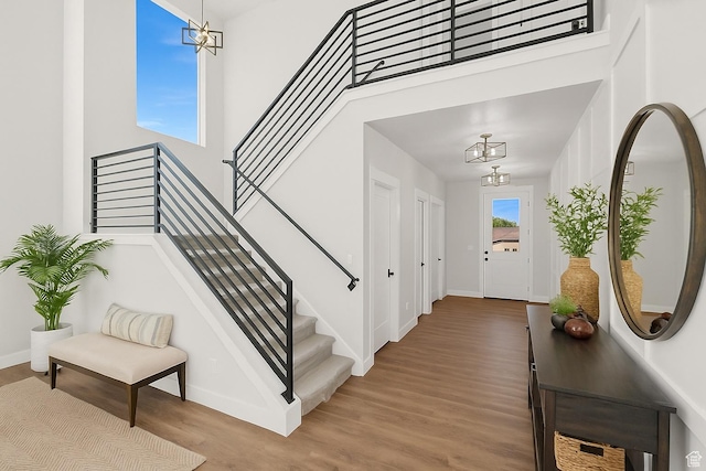 3636 N 500 E, North Ogden, UT 84414 - entryway with a chandelier, a towering ceiling, wood finished floors, and stairway