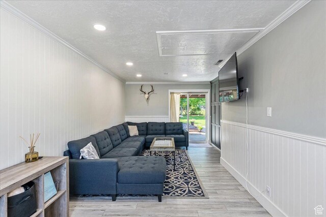 104 E 650 N, Bountiful, UT 84010 - living area featuring a textured ceiling, crown molding, light wood finished floors, and a wainscoted wall