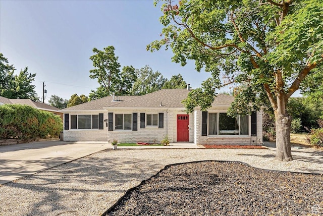 104 E 650 N, Bountiful, UT 84010 - ranch-style house with brick siding, a shingled roof, and driveway
