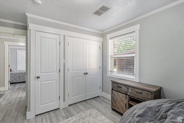 104 E 650 N, Bountiful, UT 84010 - bedroom with light wood-style floors, ornamental molding, and a textured ceiling