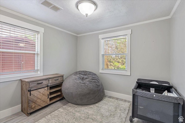 104 E 650 N, Bountiful, UT 84010 - misc room featuring wood finished floors, healthy amount of natural light, a textured ceiling, and ornamental molding