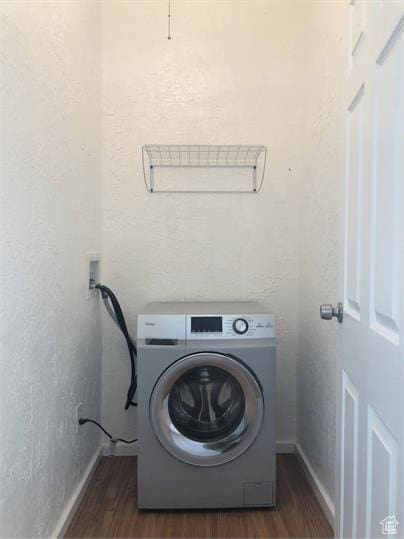 1309 E Hidden Creek Ct S, Holladay, UT 84117 - washroom with washer / clothes dryer, wood finished floors, and a textured wall