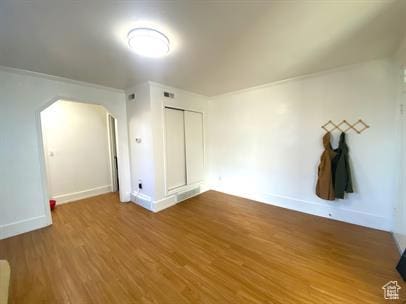 1309 E Hidden Creek Ct S, Holladay, UT 84117 - additional living space with arched walkways and wood finished floors