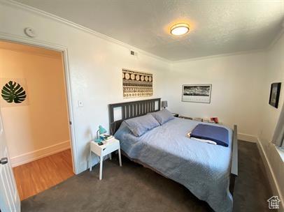 1309 E Hidden Creek Ct S, Holladay, UT 84117 - bedroom featuring ornamental molding and wood finished floors