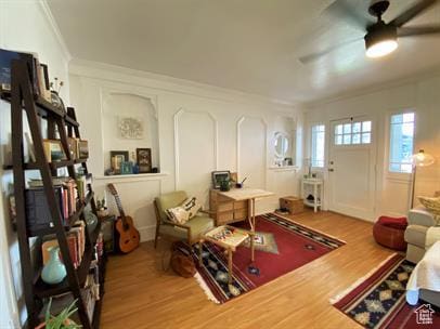 1309 E Hidden Creek Ct S, Holladay, UT 84117 - living area featuring wood finished floors, crown molding, and a ceiling fan