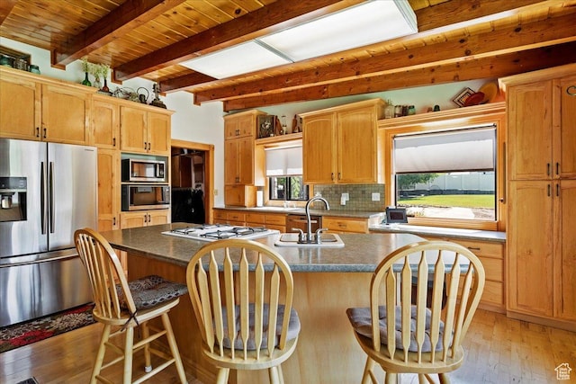 2391 Kays Creek Dr, Layton, UT 84040 - kitchen with stainless steel appliances, light wood-type flooring, a wood ceiling with exposed beams, backsplash, and a kitchen island with sink