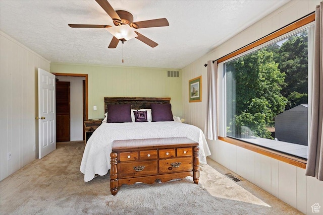 2391 Kays Creek Dr, Layton, UT 84040 - bedroom with a textured ceiling, carpet flooring, wooden walls, and ceiling fan