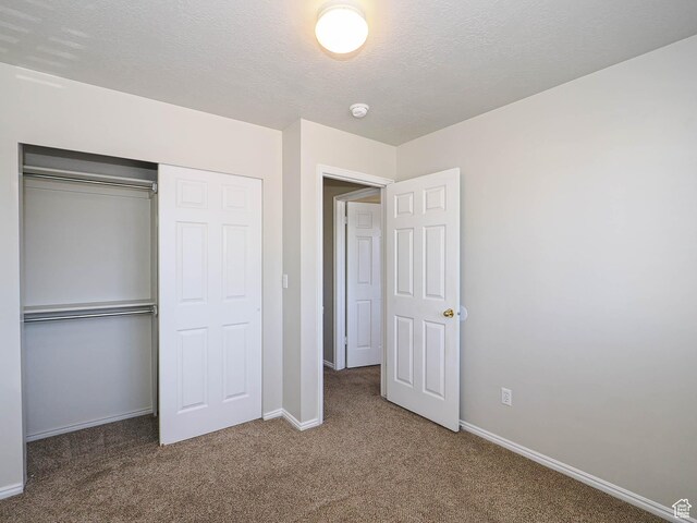 136 W 1980 S, Clearfield, UT 84015 - unfurnished bedroom featuring carpet floors, a closet, and a textured ceiling
