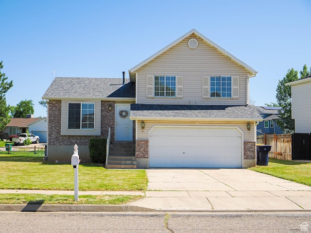 136 W 1980 S, Clearfield, UT 84015 - tri-level home featuring an attached garage, brick siding, driveway, and a shingled roof