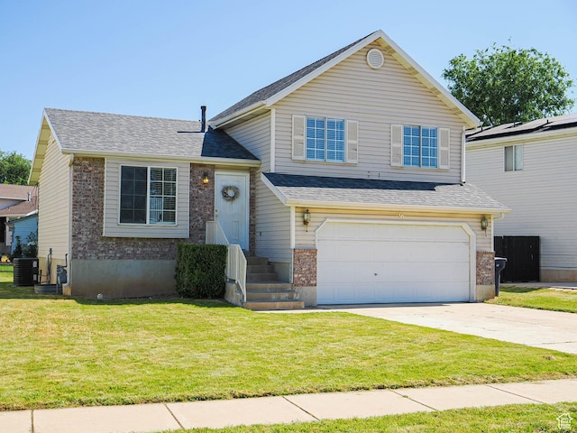 136 W 1980 S, Clearfield, UT 84015 - split level home featuring a garage, concrete driveway, a front lawn, and brick siding
