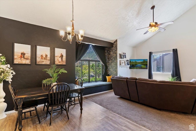1175 E Canyon Rd Unit 83, Ogden, UT 84404 - dining room with a chandelier, a textured ceiling, vaulted ceiling, wood finished floors, and a ceiling fan