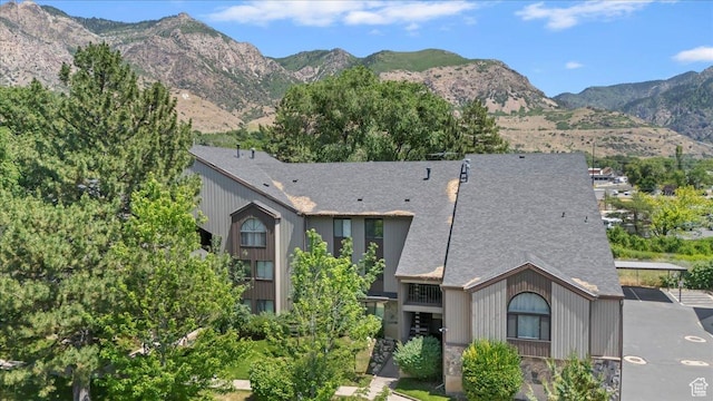 1175 E Canyon Rd Unit 83, Ogden, UT 84404 - view of front of property featuring a mountain view, roof with shingles, and stone siding