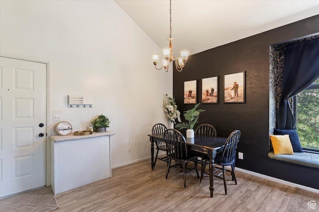 1175 E Canyon Rd Unit 83, Ogden, UT 84404 - dining space with a chandelier, light wood-type flooring, and high vaulted ceiling