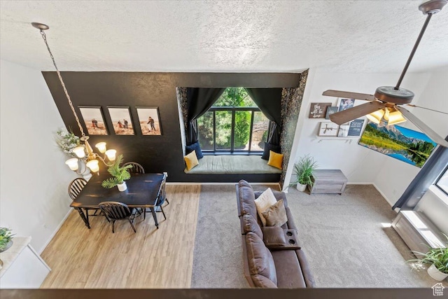 1175 E Canyon Rd Unit 83, Ogden, UT 84404 - living room with a textured ceiling, wood finished floors, and a ceiling fan