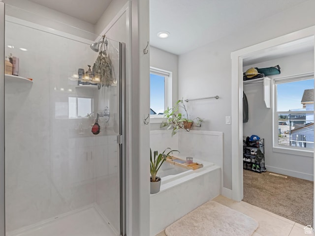 3187 N 3450 W, Plain City, UT 84404 - bathroom with a stall shower, healthy amount of natural light, a bath, and tile patterned flooring