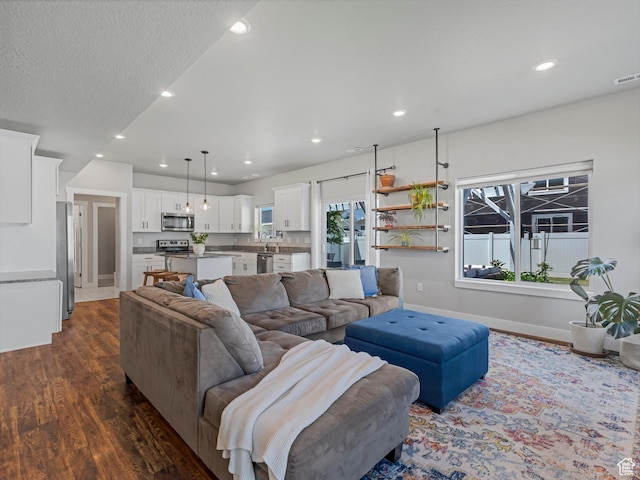 3187 N 3450 W, Plain City, UT 84404 - living room featuring dark wood finished floors and recessed lighting