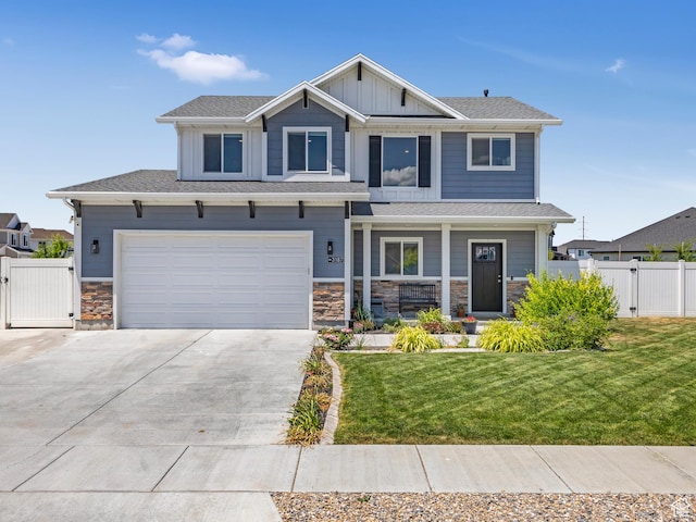 3187 N 3450 W, Plain City, UT 84404 - craftsman inspired home with a gate, a porch, driveway, stone siding, and a garage