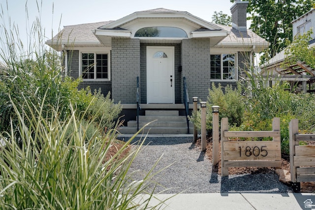 1805 S 500 E, Salt Lake City, UT 84105 - view of front of home with brick siding, a chimney, and entry steps