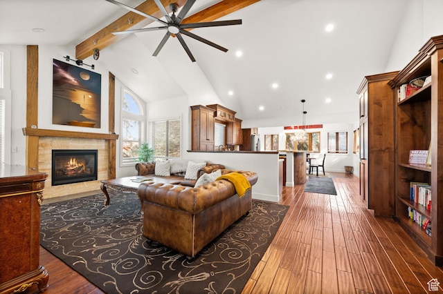 1492 Meadow Rd, Snyderville, UT 84098 - living room featuring ceiling fan, a fireplace, beamed ceiling, high vaulted ceiling, and wood-type flooring