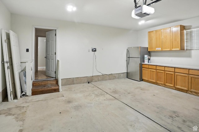 452 E 875 N, Ogden, UT 84404 - garage featuring freestanding refrigerator and a garage door opener
