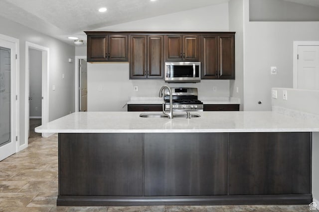 452 E 875 N, Ogden, UT 84404 - kitchen featuring appliances with stainless steel finishes, light countertops, dark brown cabinets, recessed lighting, and vaulted ceiling