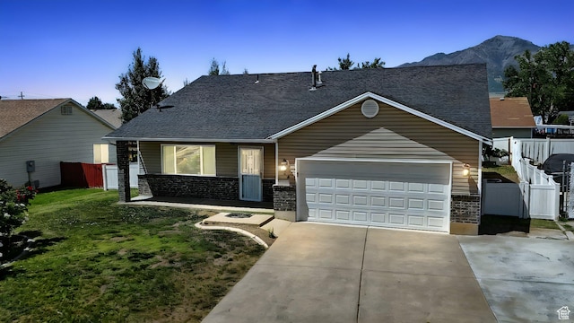 452 E 875 N, Ogden, UT 84404 - view of front of property featuring driveway, a garage, a shingled roof, and a mountain view