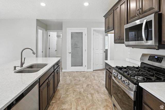 452 E 875 N, Ogden, UT 84404 - kitchen featuring stainless steel appliances, light countertops, dark brown cabinets, and recessed lighting