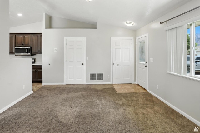 452 E 875 N, Ogden, UT 84404 - unfurnished living room with vaulted ceiling and light colored carpet