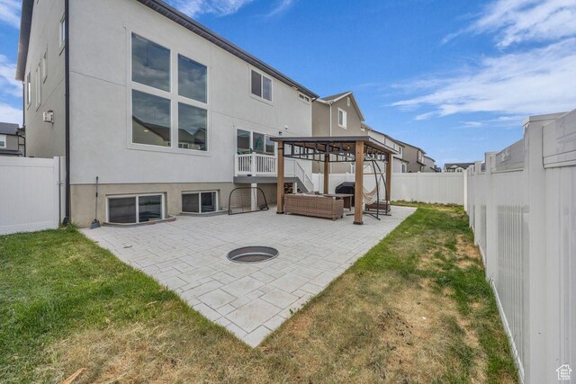 12357 S Eovaldi Ave, Herriman, UT 84096 - rear view of house featuring stucco siding, a patio, a fenced backyard, and stairs