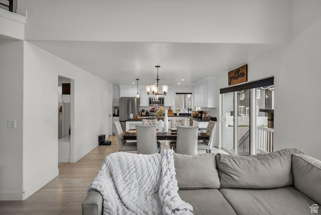12357 S Eovaldi Ave, Herriman, UT 84096 - living area with a chandelier, light wood-style floors, and recessed lighting