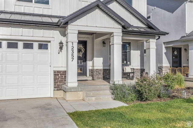 12357 S Eovaldi Ave, Herriman, UT 84096 - doorway to property with a standing seam roof, stone siding, a garage, board and batten siding, and a metal roof